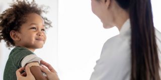 A baby with medical staff